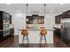 Well-appointed kitchen with dark wood cabinetry, a center island, and stainless steel appliances at 510 Towneside Ln, Marietta, GA 30064