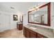 Elegant main bathroom with granite counters, double sinks, and a large mirror at 510 Towneside Ln, Marietta, GA 30064
