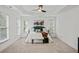 Bright and airy main bedroom with a tray ceiling, ceiling fan, and lots of natural light at 510 Towneside Ln, Marietta, GA 30064