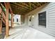 Covered concrete patio features stairs and entrance to home at 510 Towneside Ln, Marietta, GA 30064