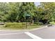 Corner of a street with manicured garden with colorful flowers and address sign at 510 Towneside Ln, Marietta, GA 30064