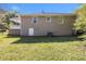 View of the backyard featuring the home's exterior and a covered patio at 1958 Long Dr, Decatur, GA 30032