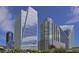 Modern buildings with glass exteriors create a striking architectural landscape against a clear, blue sky at 3325 Piedmont Ne Rd # 2104, Atlanta, GA 30305