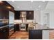 A stylish kitchen with stainless steel appliances, dark wood cabinets, and granite countertops at 3325 Piedmont Ne Rd # 2104, Atlanta, GA 30305