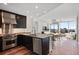 Modern kitchen features stainless steel appliances, dark cabinets, and a breakfast bar with city views at 3325 Piedmont Ne Rd # 2104, Atlanta, GA 30305