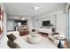 Cozy living room with hardwood floors, modern furniture and large windows at 3325 Piedmont Ne Rd # 2104, Atlanta, GA 30305