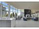 Elegant lounge area with a fireplace, comfortable seating, and panoramic city views at 3325 Piedmont Ne Rd # 2104, Atlanta, GA 30305