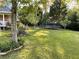 Lush backyard features a trampoline and mature trees for a private outdoor space at 5167 Manitu Sw Ct, Lilburn, GA 30047
