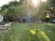Beautiful backyard featuring a playground set, a patio area, and well-maintained lawn at 5167 Manitu Sw Ct, Lilburn, GA 30047