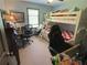 Spacious bedroom with bunk beds, a desk, two chairs, and natural light at 5167 Manitu Sw Ct, Lilburn, GA 30047