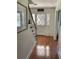 Foyer featuring hardwood floors, staircase, and a charming front door with decorative glass at 5167 Manitu Sw Ct, Lilburn, GA 30047