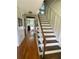 Inviting foyer with hardwood floors and a staircase leading to the second level at 5167 Manitu Sw Ct, Lilburn, GA 30047