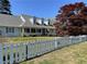 Inviting home with a long front porch,dormer windows, and mature tree at 5167 Manitu Sw Ct, Lilburn, GA 30047