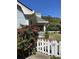 Inviting home featuring a charming white picket fence and lush landscaping at 5167 Manitu Sw Ct, Lilburn, GA 30047