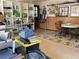 Functional garage area with organized storage, a workbench, and a dining area at 5167 Manitu Sw Ct, Lilburn, GA 30047