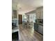 Bright kitchen and eat-in nook with stainless steel appliances and view to the back yard at 5167 Manitu Sw Ct, Lilburn, GA 30047