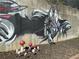 Backyard art wall featuring mushroom figures and wind spinner at 727 Channing Nw Dr, Atlanta, GA 30318