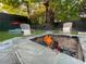 Outdoor fire pit area for relaxing evenings in your own backyard at 727 Channing Nw Dr, Atlanta, GA 30318
