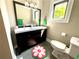 Bathroom featuring a double sink vanity and decorative rug at 727 Channing Nw Dr, Atlanta, GA 30318