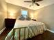 Cozy bedroom featuring a ceiling fan and warm lighting at 727 Channing Nw Dr, Atlanta, GA 30318