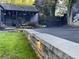 Charming home featuring a covered porch, artistic mural, and stone retaining wall at 727 Channing Nw Dr, Atlanta, GA 30318