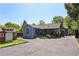 Charming home with a well-manicured yard, a shed, and a long driveway at 727 Channing Nw Dr, Atlanta, GA 30318
