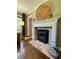 Charming fireplace with brick accents and a decorative mantel makes a cozy living space at 727 Channing Nw Dr, Atlanta, GA 30318