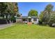 Charming home with solar panels, brick steps, and well-manicured lawn at 727 Channing Nw Dr, Atlanta, GA 30318