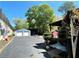 View of a detached two-car garage and lengthy driveway on a sunny day at 727 Channing Nw Dr, Atlanta, GA 30318