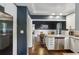 Bright kitchen featuring stainless appliances, white cabinetry, and an open layout leading to the dining area at 727 Channing Nw Dr, Atlanta, GA 30318