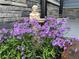 Landscaping featuring purple flowers and a statue adding charm to the home's exterior at 727 Channing Nw Dr, Atlanta, GA 30318