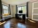Office space with a black desk, bench, hardwood floors, natural light and neutral walls at 727 Channing Nw Dr, Atlanta, GA 30318