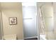Inviting bathroom with tub and shower, a neutral wall color and modern decor at 1715 Crestwell Ln, Grayson, GA 30017