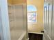 Bathroom with a shower-tub combo and a window with natural light at 1715 Crestwell Ln, Grayson, GA 30017