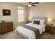 Cozy bedroom with a large window, ceiling fan, and well appointed contemporary decor at 1715 Crestwell Ln, Grayson, GA 30017