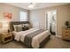 Inviting bedroom with a comfortable bed, soft lighting, and en-suite bathroom at 1715 Crestwell Ln, Grayson, GA 30017