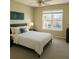 Bright bedroom featuring a large window, neutral carpet and contemporary decor at 1715 Crestwell Ln, Grayson, GA 30017