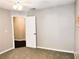 This bedroom is spacious and features neutral carpet and a neutral paint palette at 1715 Crestwell Ln, Grayson, GA 30017