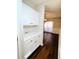 Butler Pantry with white cabinets and view to the dining room at 1715 Crestwell Ln, Grayson, GA 30017