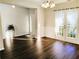 View of the dining room featuring wood floors and white french doors to the exterior at 1715 Crestwell Ln, Grayson, GA 30017