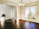 View of the dining room featuring wood floors and white french doors to the exterior at 1715 Crestwell Ln, Grayson, GA 30017