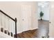 Entryway featuring wood floors and access to staircase at 1715 Crestwell Ln, Grayson, GA 30017