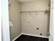 Empty laundry room with shelving and hookups, ready for customization at 1715 Crestwell Ln, Grayson, GA 30017