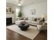 Bright living room with a fireplace, modern furniture and natural light at 1715 Crestwell Ln, Grayson, GA 30017