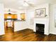 Inviting open floor plan featuring a fireplace, hardwood floors and a modern kitchen at 1715 Crestwell Ln, Grayson, GA 30017