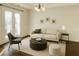 Bright living room with hardwood floors, modern furniture, and elegant decor at 1715 Crestwell Ln, Grayson, GA 30017