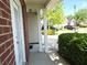 View of a home with siding and brick accents, featuring a charming side porch with white columns at 1715 Crestwell Ln, Grayson, GA 30017