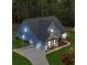 Aerial image showcasing the home's modern design, three car garage and lush landscaping at 174 Vandiver Ct, Acworth, GA 30101