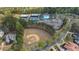 Aerial view of community baseball field, tennis courts, clubhouse and pool at 174 Vandiver Ct, Acworth, GA 30101
