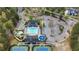 Aerial view of the community pool, tennis courts, playground, and clubhouse at 174 Vandiver Ct, Acworth, GA 30101